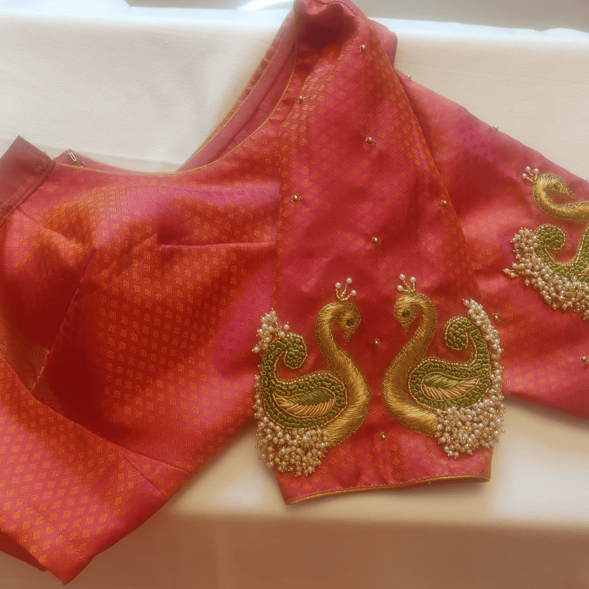 store_01GT9YVKDCY4Q2GP2Q2XY9CW6K_2Fassets_2F1677718601752-Hand_2520Embroidered_2520Blouse_2520with_2520Peacock_2520design